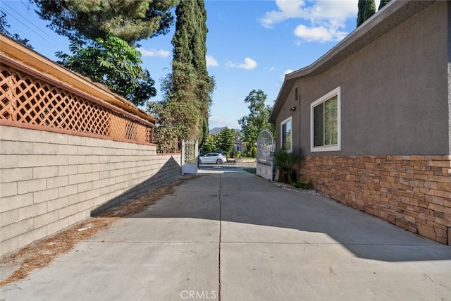 view of side of property featuring a patio area