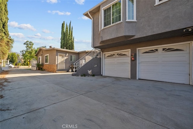 view of side of home featuring a garage