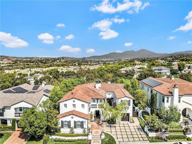 birds eye view of property with a mountain view and a residential view