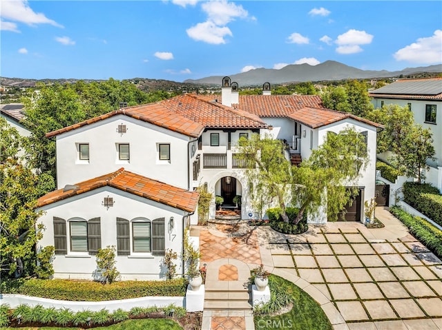 mediterranean / spanish house with a mountain view