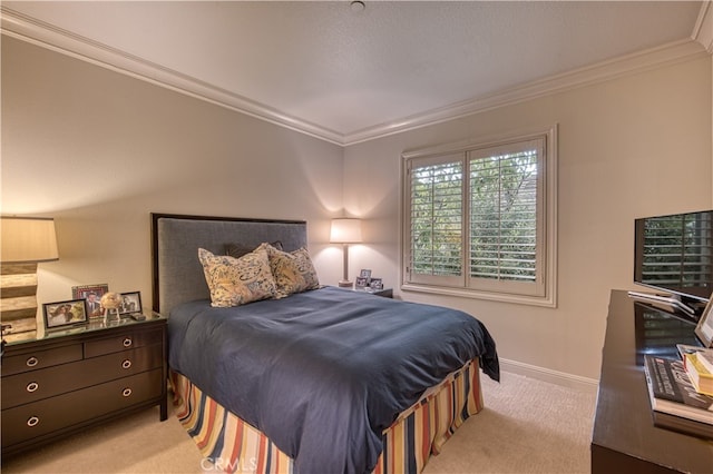 bedroom with ornamental molding and light carpet