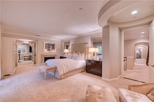 bedroom featuring crown molding and light carpet