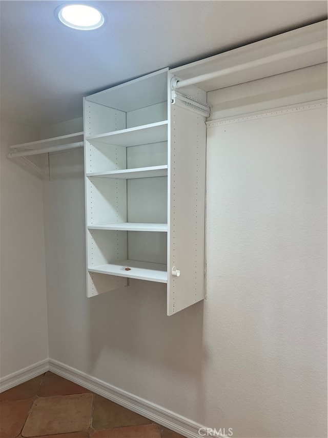 spacious closet featuring tile patterned floors