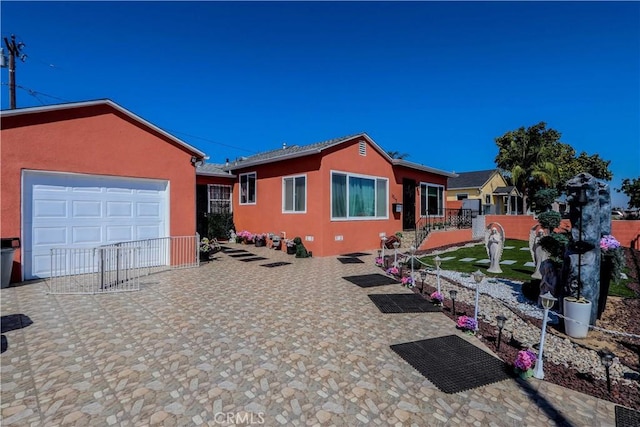 ranch-style house featuring a garage