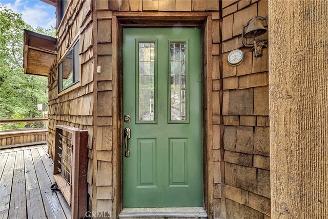 entrance to property with a deck