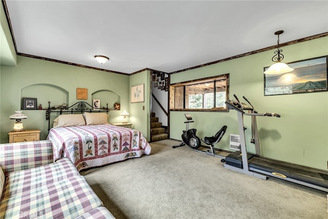 bedroom featuring ornamental molding and carpet floors