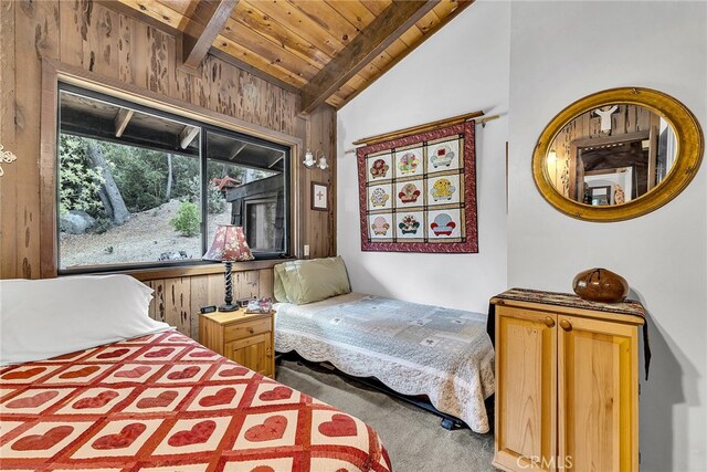 bedroom featuring wooden ceiling, vaulted ceiling with beams, carpet, and wood walls