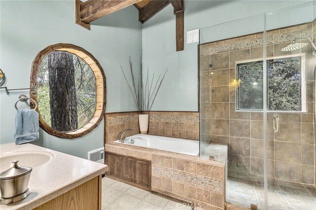 bathroom featuring vanity, shower with separate bathtub, and tile patterned flooring