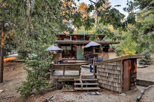 rear view of property with a deck