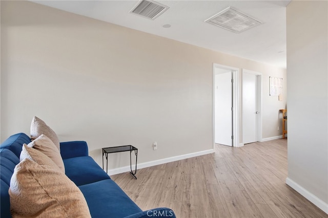 living area with light hardwood / wood-style floors