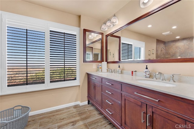 bathroom with wood-type flooring and vanity