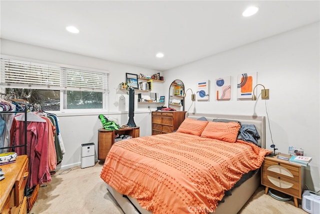 bedroom featuring light colored carpet