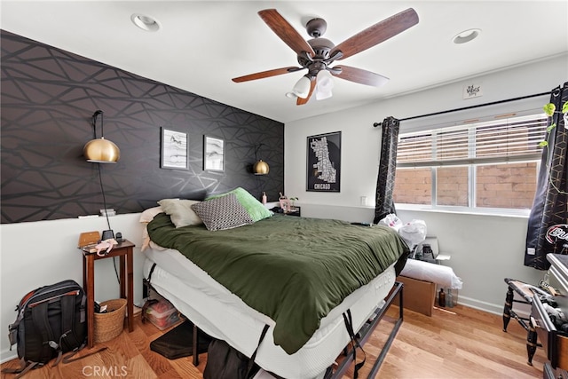 bedroom featuring ceiling fan and light wood-type flooring