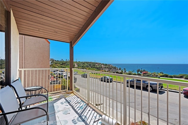 balcony featuring a water view