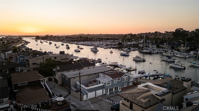 aerial view at dusk with a water view