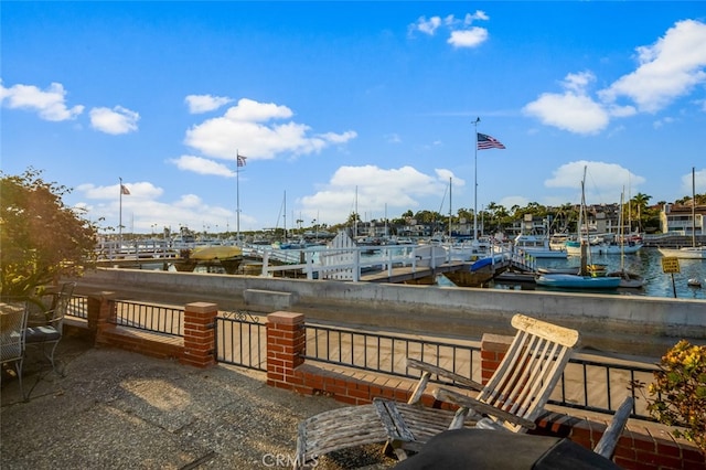 view of patio with a water view