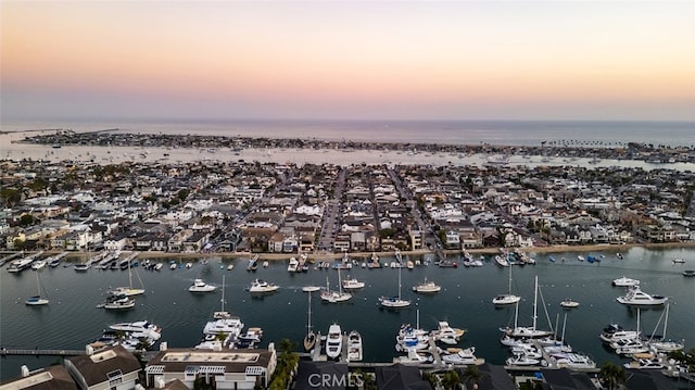 aerial view at dusk with a water view