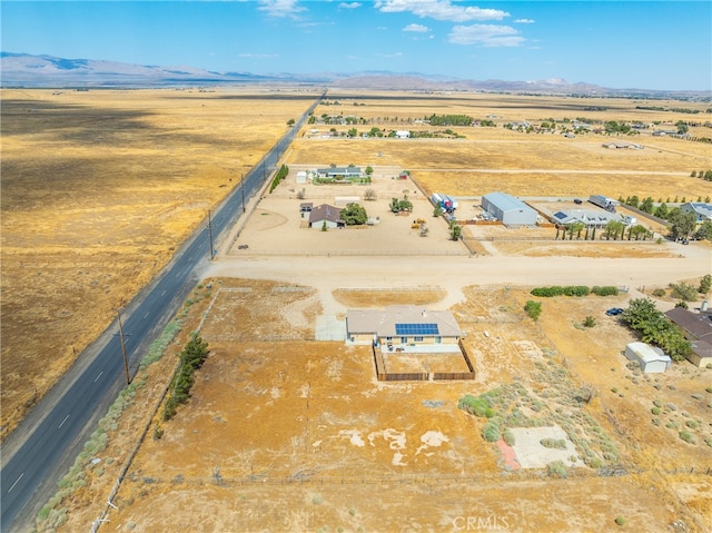 birds eye view of property with a mountain view and a rural view