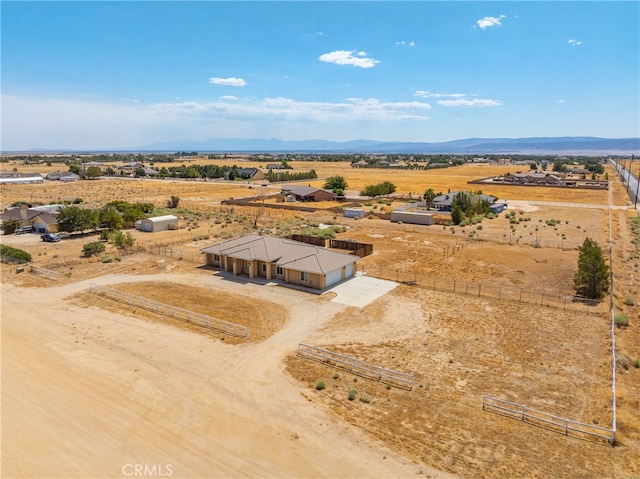 birds eye view of property featuring a rural view and a mountain view