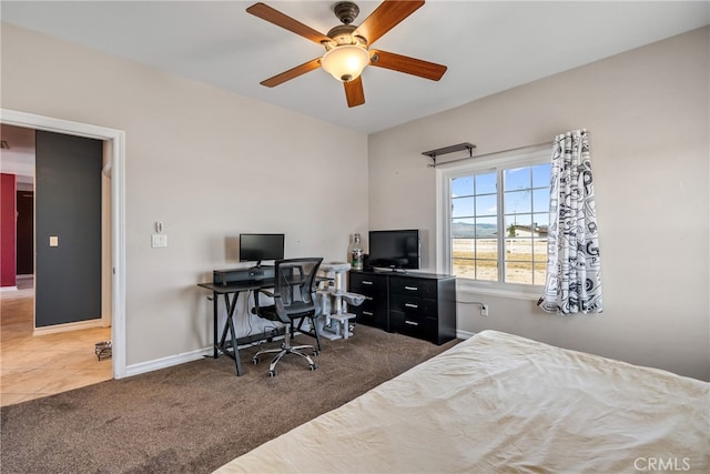 bedroom featuring dark colored carpet and ceiling fan