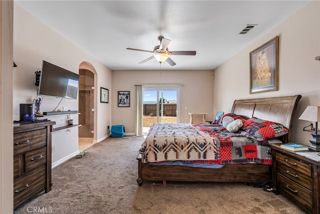 carpeted bedroom with ceiling fan and access to exterior