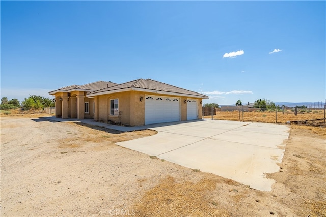 view of front of property featuring a garage