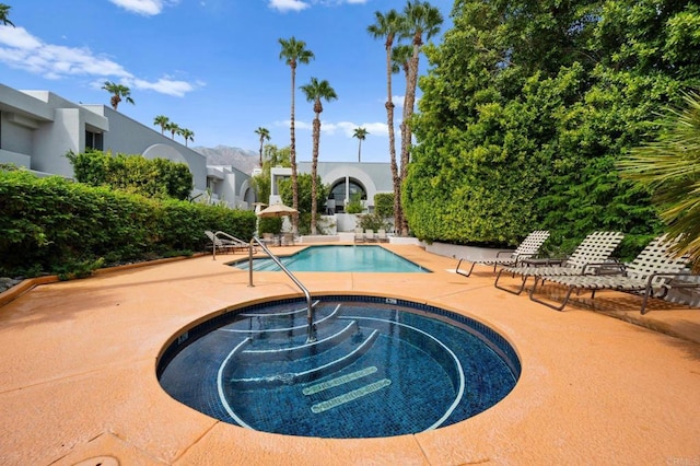 view of swimming pool with a patio area