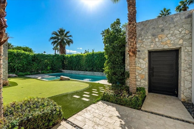 view of yard with a fenced in pool