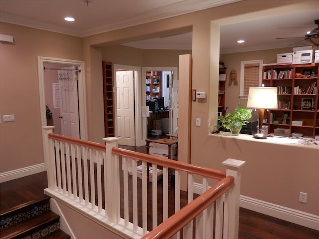 hallway featuring ornamental molding and dark hardwood / wood-style floors