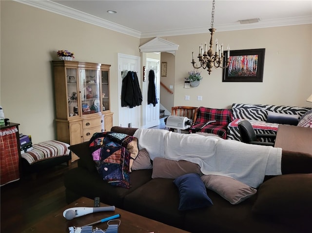 living room with hardwood / wood-style floors, ornamental molding, and an inviting chandelier