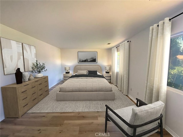 bedroom with light wood-type flooring