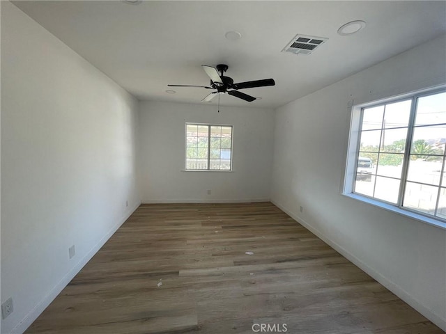 16003 Baker Canyon Rd, Canyon Country, CA 91390 - spare room with baseboards, visible vents, ceiling fan, and wood finished floors