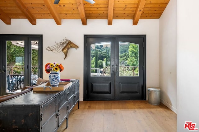 entryway with french doors, light hardwood / wood-style flooring, and beam ceiling