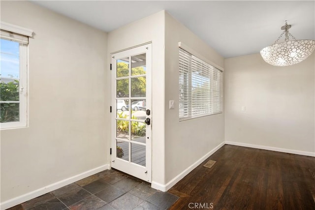 doorway to outside featuring dark hardwood / wood-style flooring