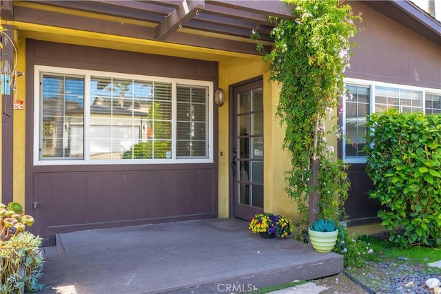 property entrance with a deck