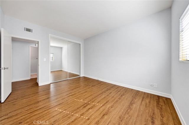 empty room featuring wood-type flooring