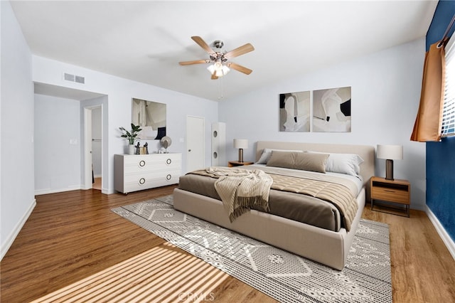 bedroom featuring ceiling fan and hardwood / wood-style flooring