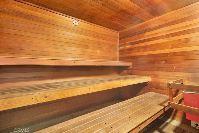 view of sauna / steam room with wood walls and wooden ceiling