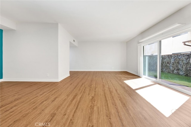 unfurnished room featuring light hardwood / wood-style floors