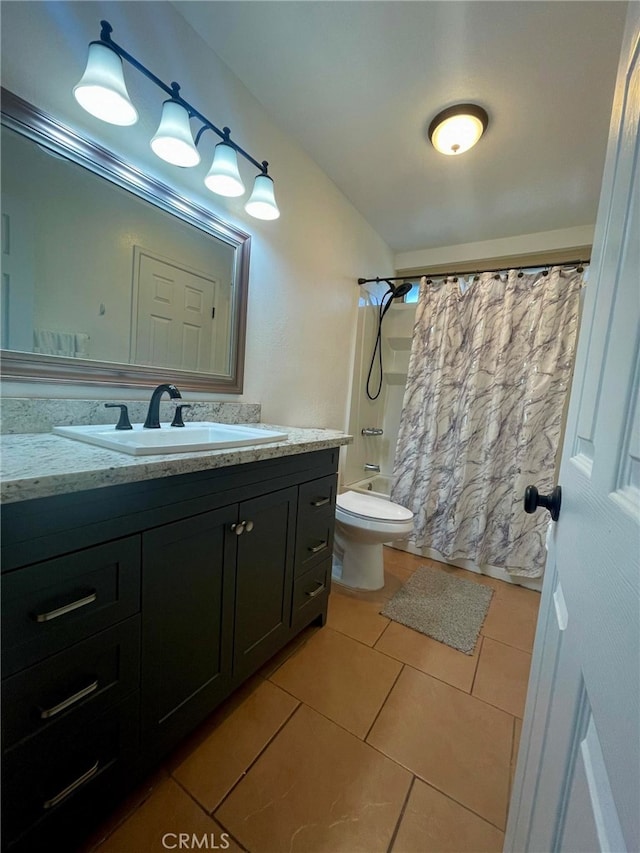 full bathroom featuring ornamental molding, tile patterned floors, shower / bath combo with shower curtain, vanity, and toilet