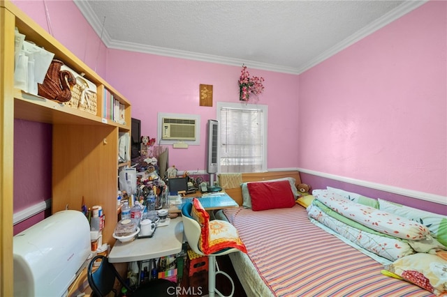 bedroom with crown molding, an AC wall unit, and a textured ceiling