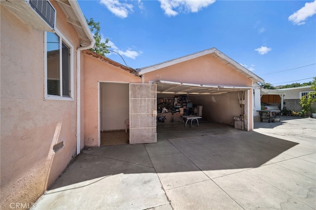 view of property exterior with a patio