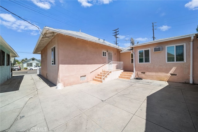 rear view of property featuring a patio area