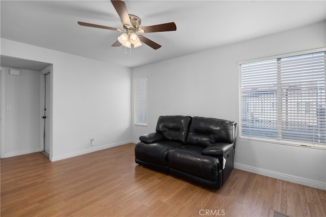 sitting room with ceiling fan and light hardwood / wood-style floors