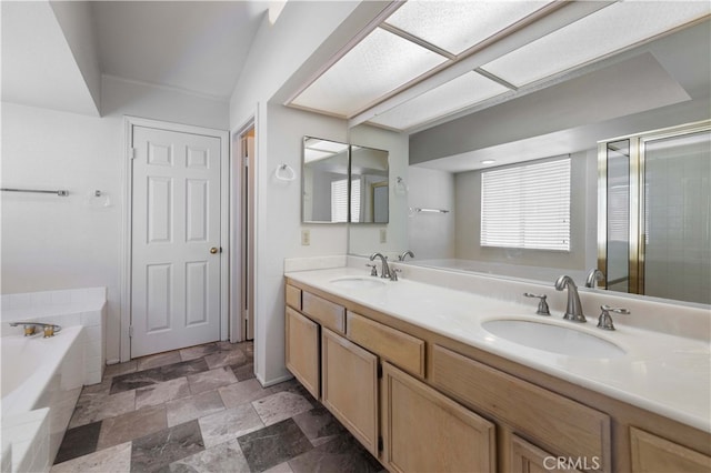 bathroom with independent shower and bath and vanity