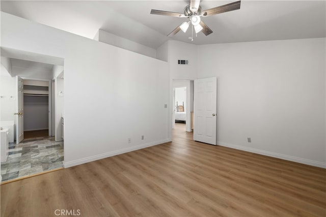 unfurnished room with high vaulted ceiling, ceiling fan, and hardwood / wood-style flooring