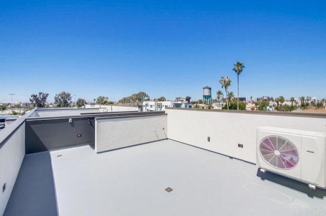 view of patio / terrace with a balcony and ac unit