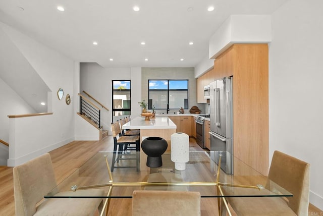 dining area with light wood-type flooring