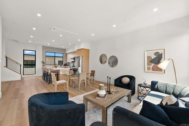 living room with light hardwood / wood-style floors