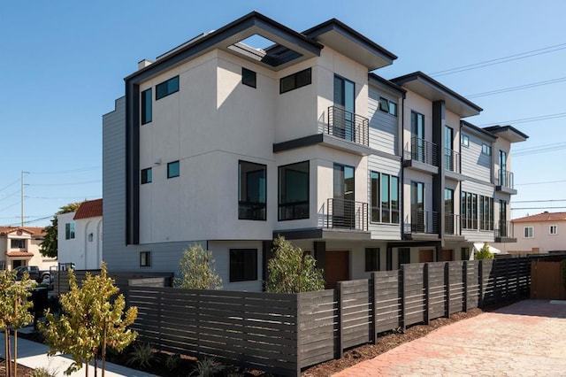 view of front of house featuring a balcony